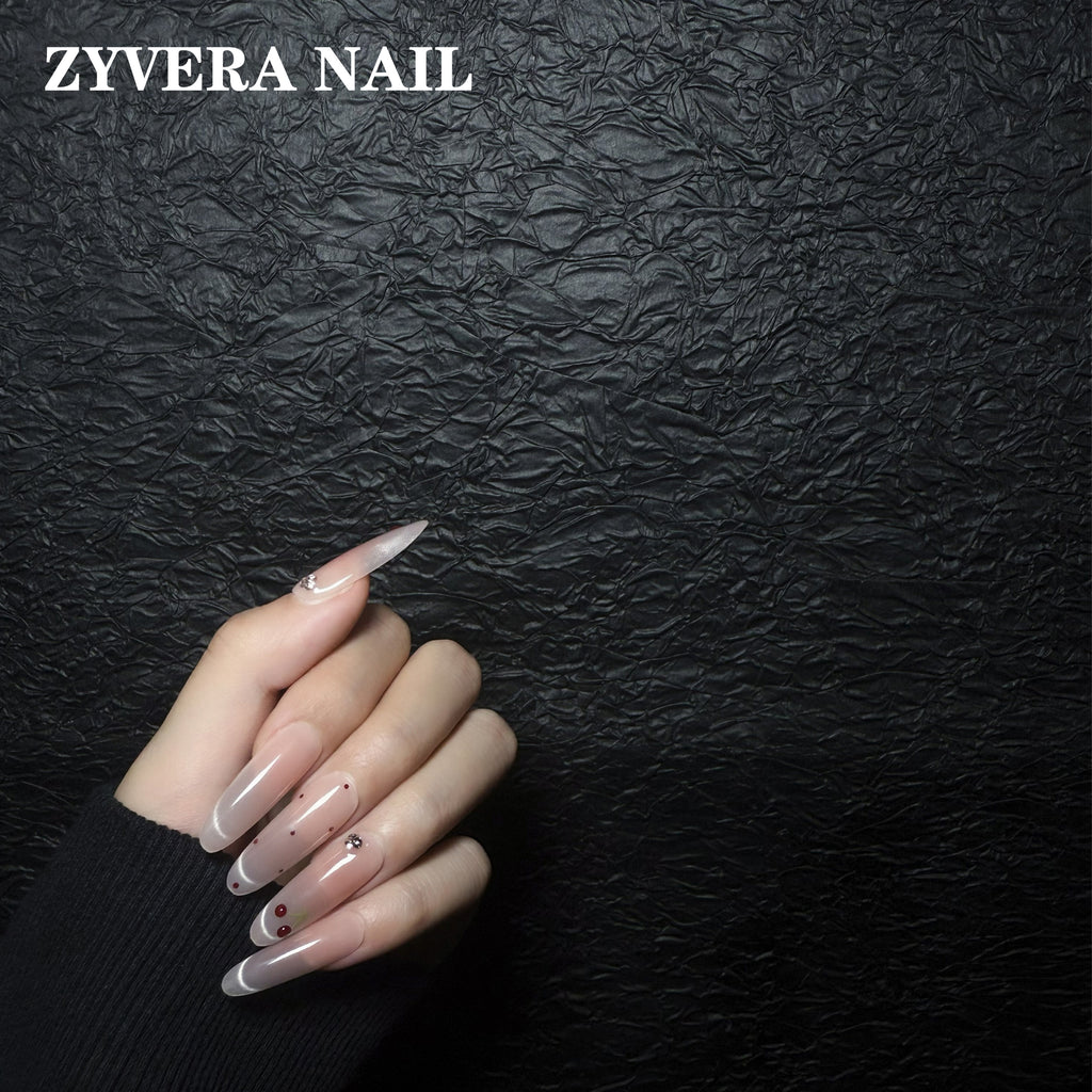 soft pink cherry French tip oval press-on nails worn on hand
