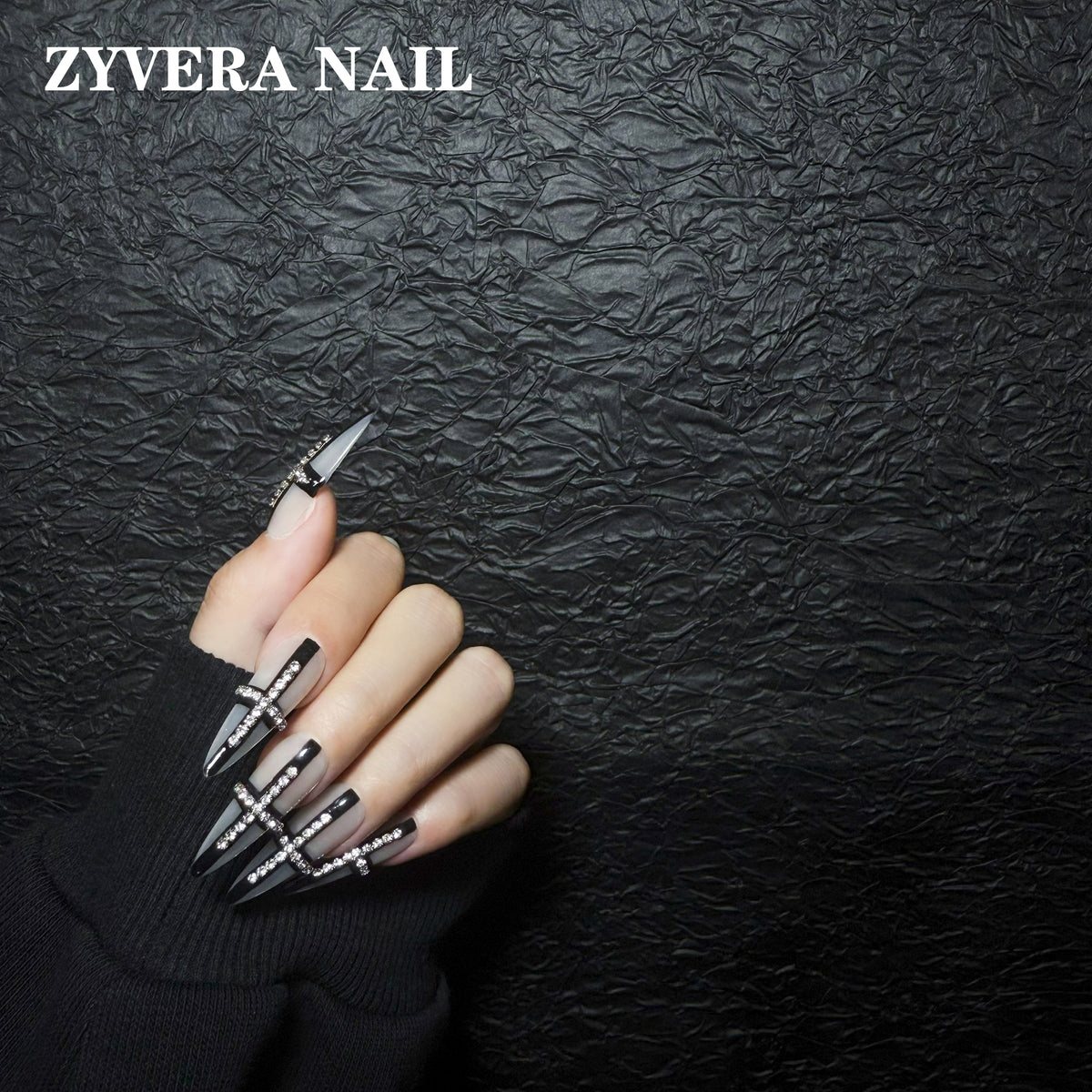 black smoky clear crystal cross stiletto press-on nails worn on hand