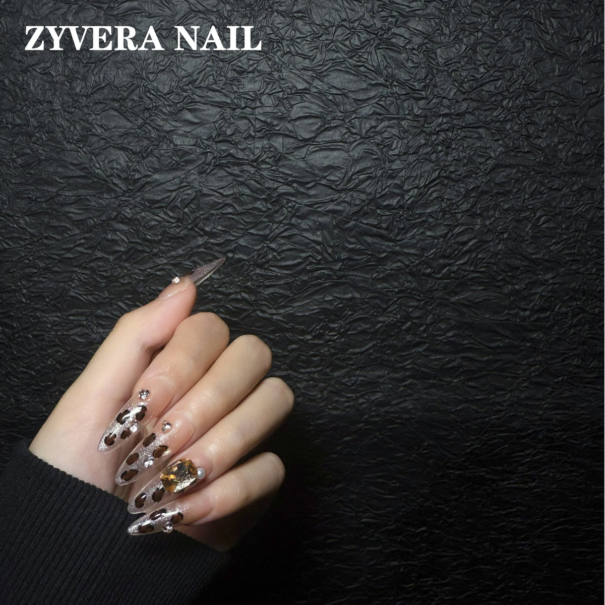 nude brown leopard crystal almond press-on nails worn on hand