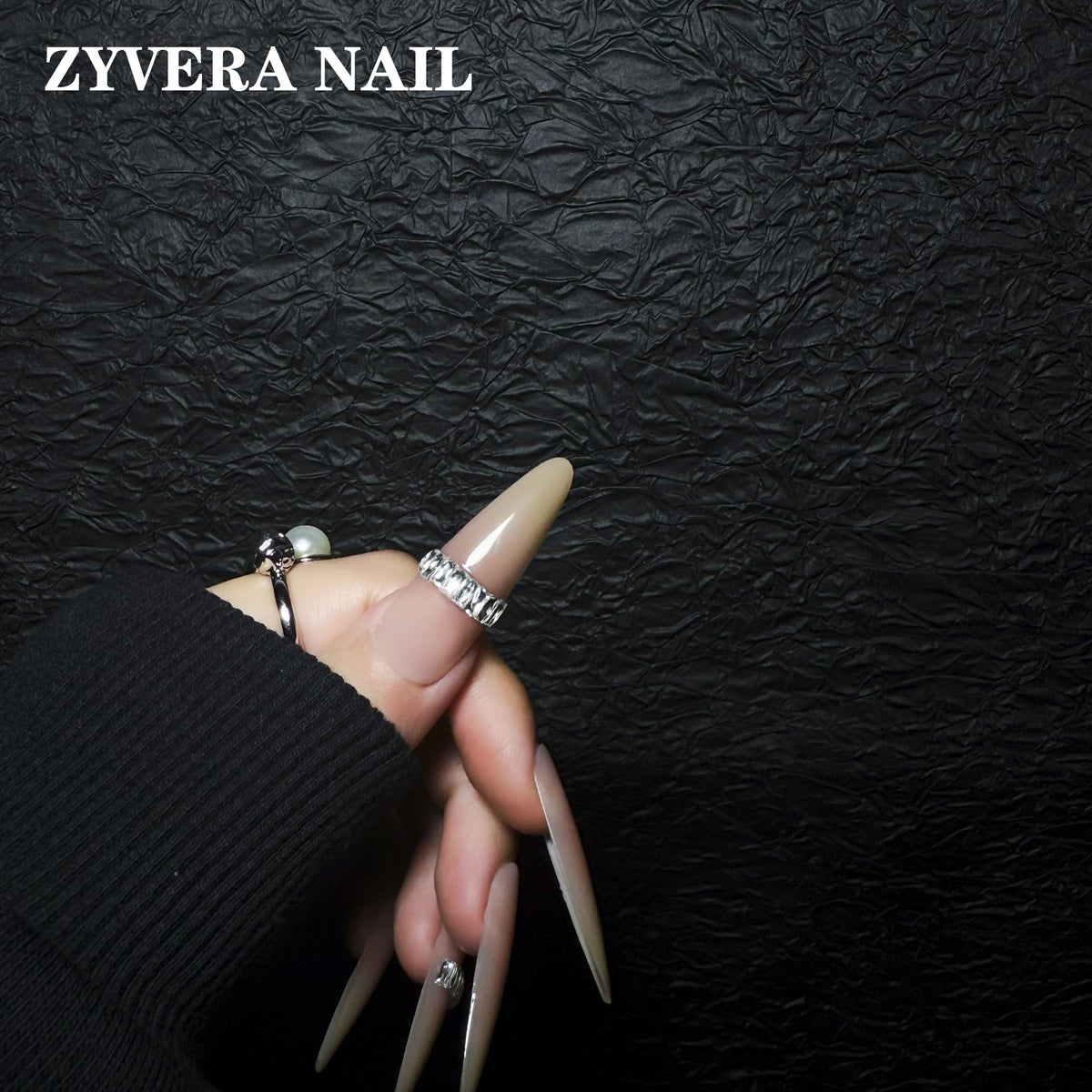 glossy nude minimalist crystal band almond press-on nails worn on hand